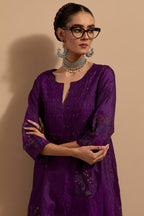 Purple crushed silk hand block printed kurta set with pin tucks at yoke, highlighted with multi colored thread embroidery.