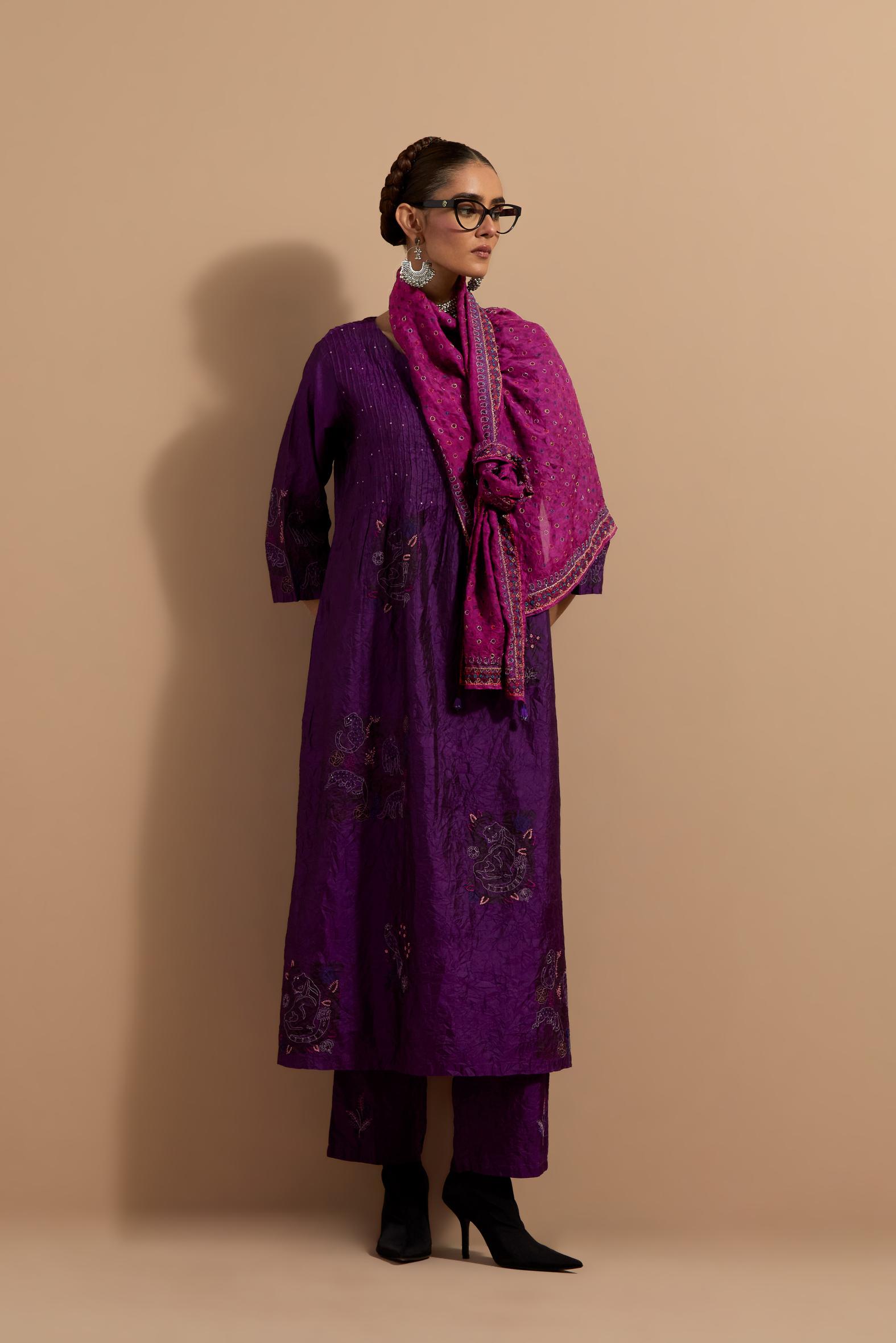 Purple crushed silk hand block printed kurta set with pin tucks at yoke, highlighted with multi colored thread embroidery.
