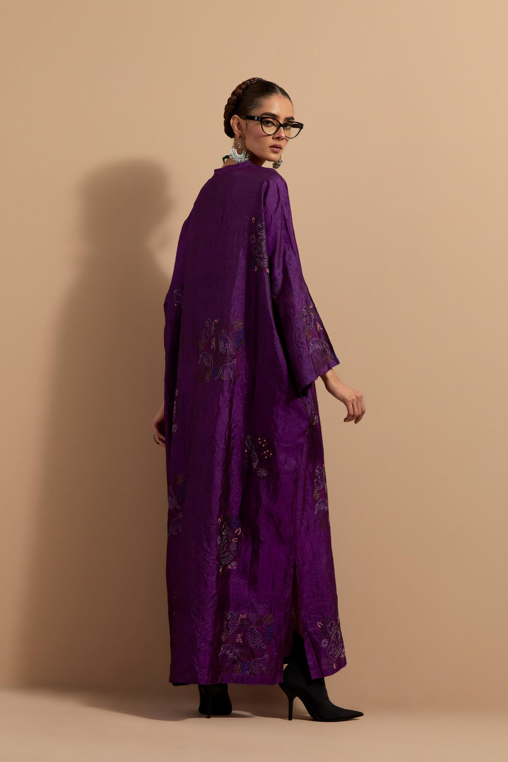 Purple crushed silk hand block printed long kaftan, highlighted with multi colored thread embroidery, paired with Red hand crushed block printed silk stole with quilted embroidery and beaded tassels.