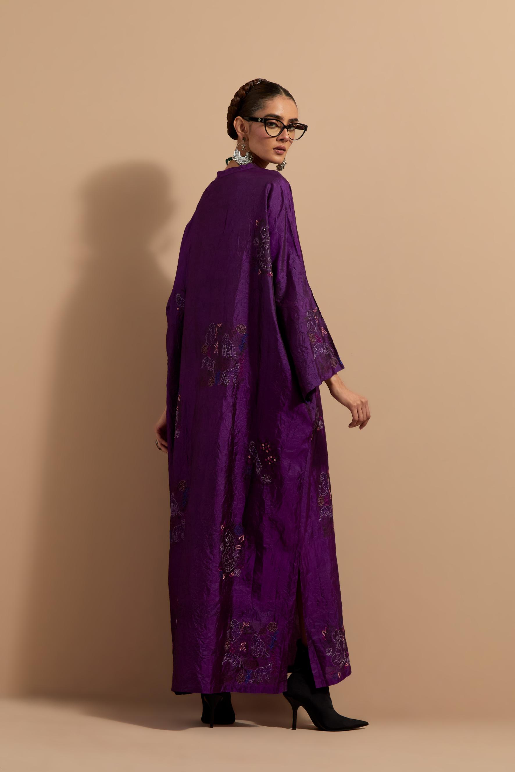 Purple crushed silk hand block printed long kaftan, highlighted with multi colored thread embroidery, paired with Red hand crushed block printed silk stole with quilted embroidery and beaded tassels.