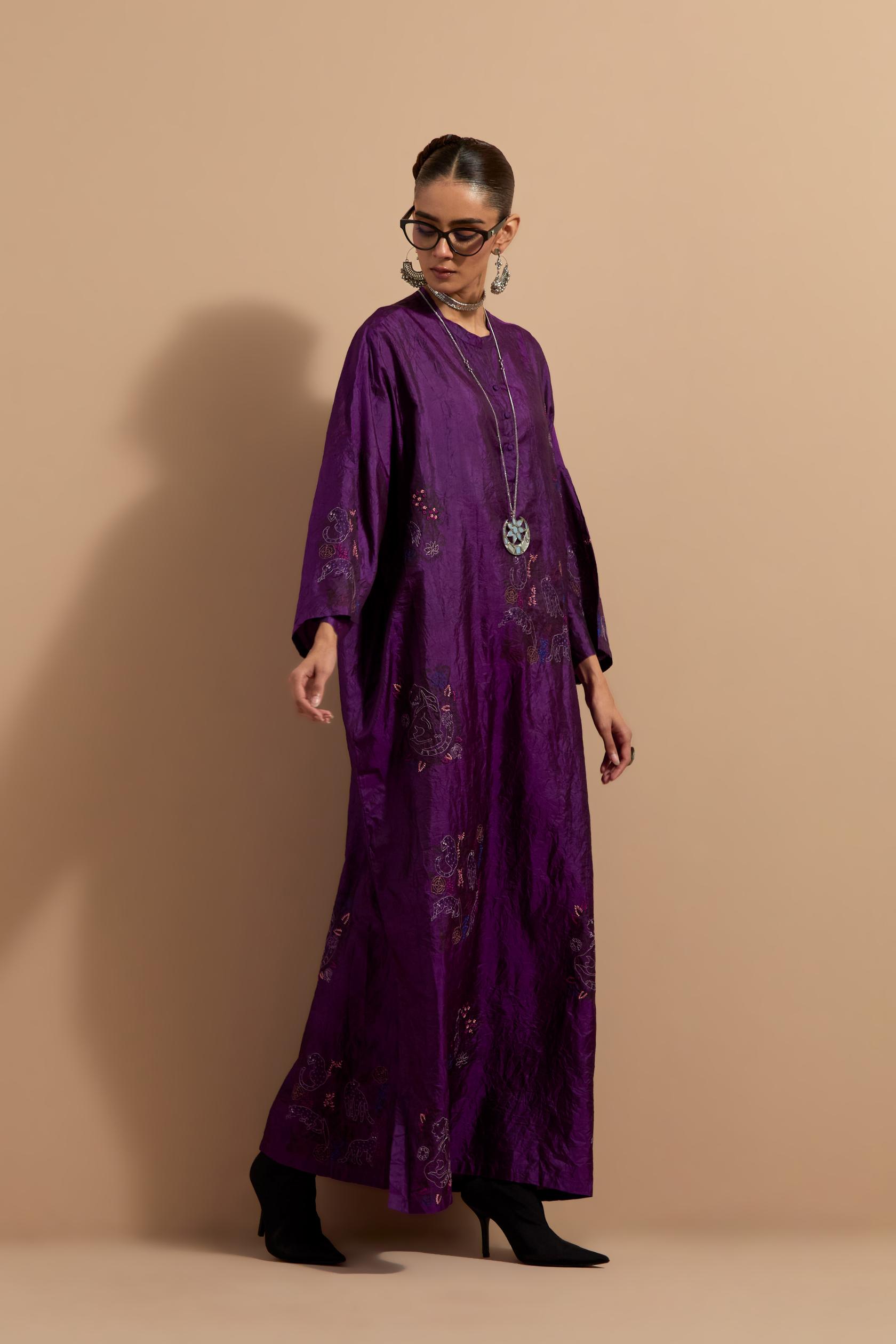 Purple crushed silk hand block printed long kaftan, highlighted with multi colored thread embroidery, paired with Red hand crushed block printed silk stole with quilted embroidery and beaded tassels.