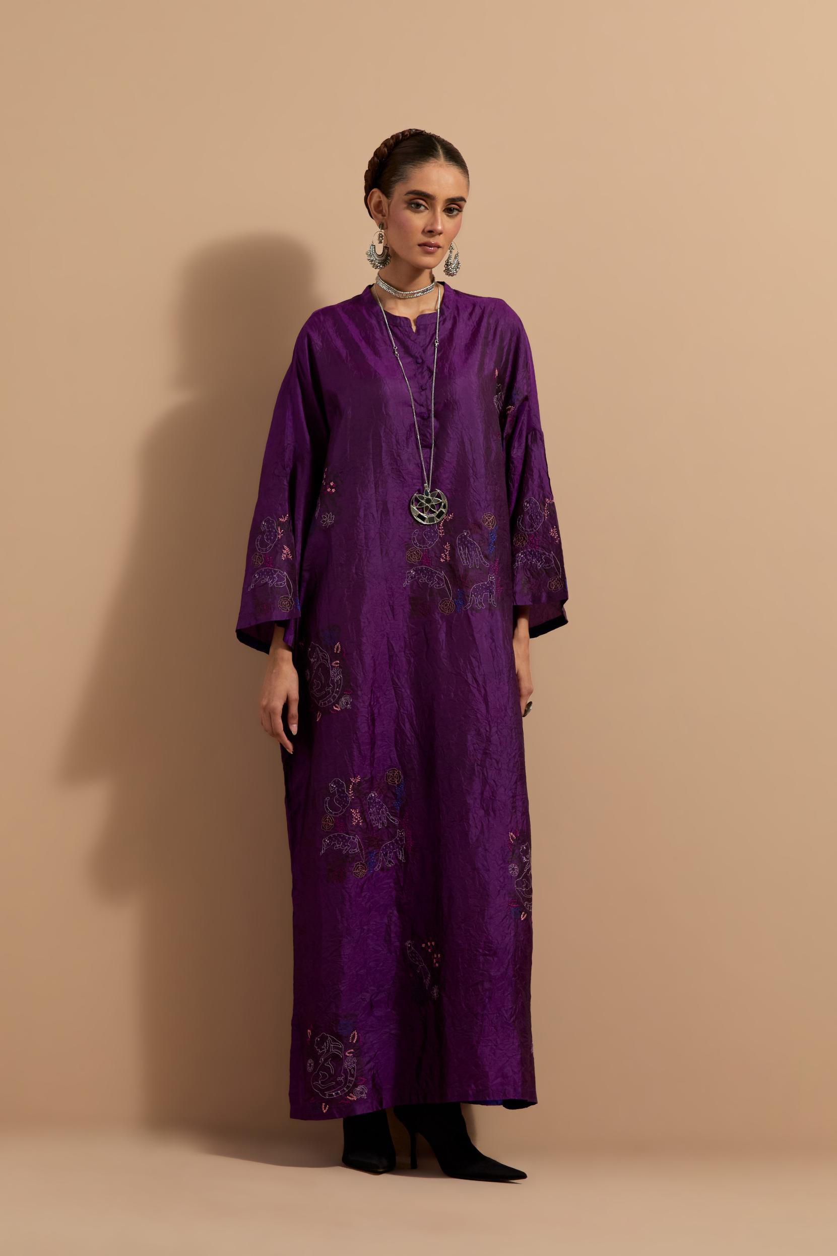 Purple crushed silk hand block printed long kaftan, highlighted with multi colored thread embroidery, paired with Red hand crushed block printed silk stole with quilted embroidery and beaded tassels.