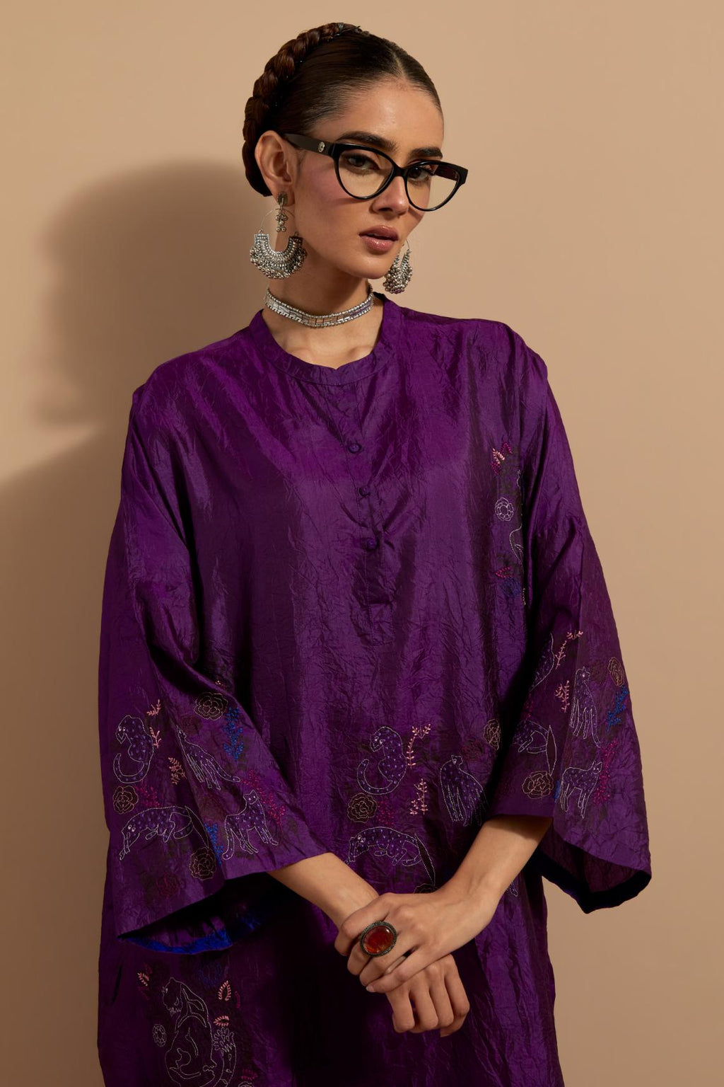 Purple crushed silk hand block printed long kaftan, highlighted with multi colored thread embroidery, paired with Red hand crushed block printed silk stole with quilted embroidery and beaded tassels.