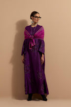 Purple crushed silk hand block printed long kaftan, highlighted with multi colored thread embroidery, paired with Red hand crushed block printed silk stole with quilted embroidery and beaded tassels.