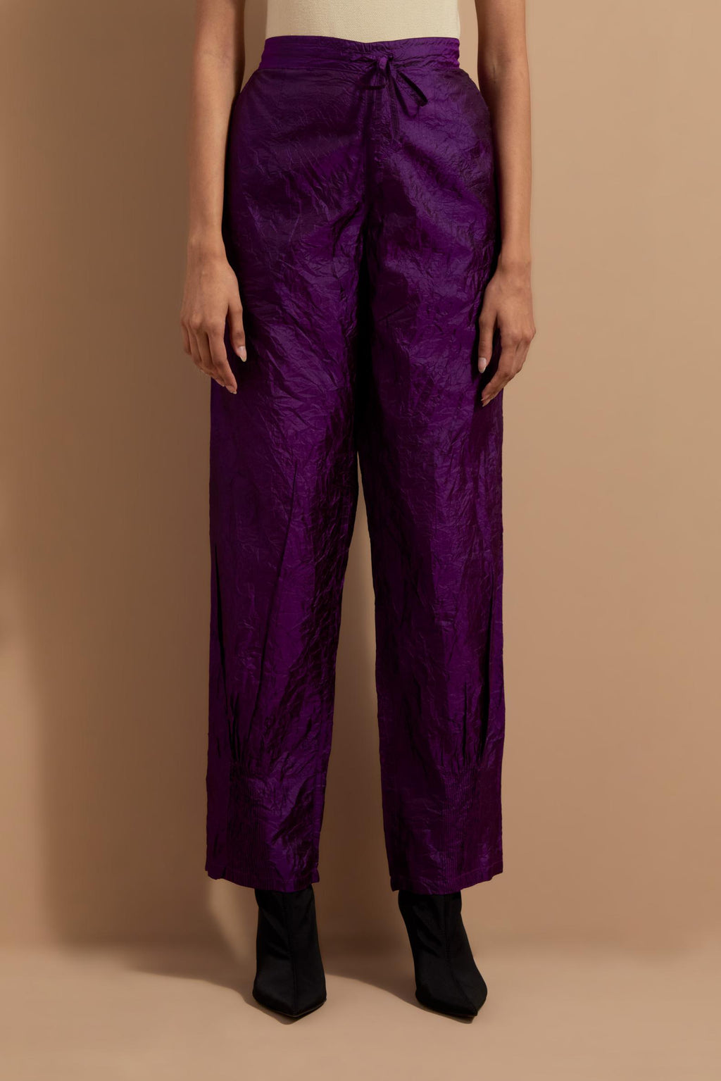 Purple crushed silk hand block printed pants with pin tucks detailing at hem.