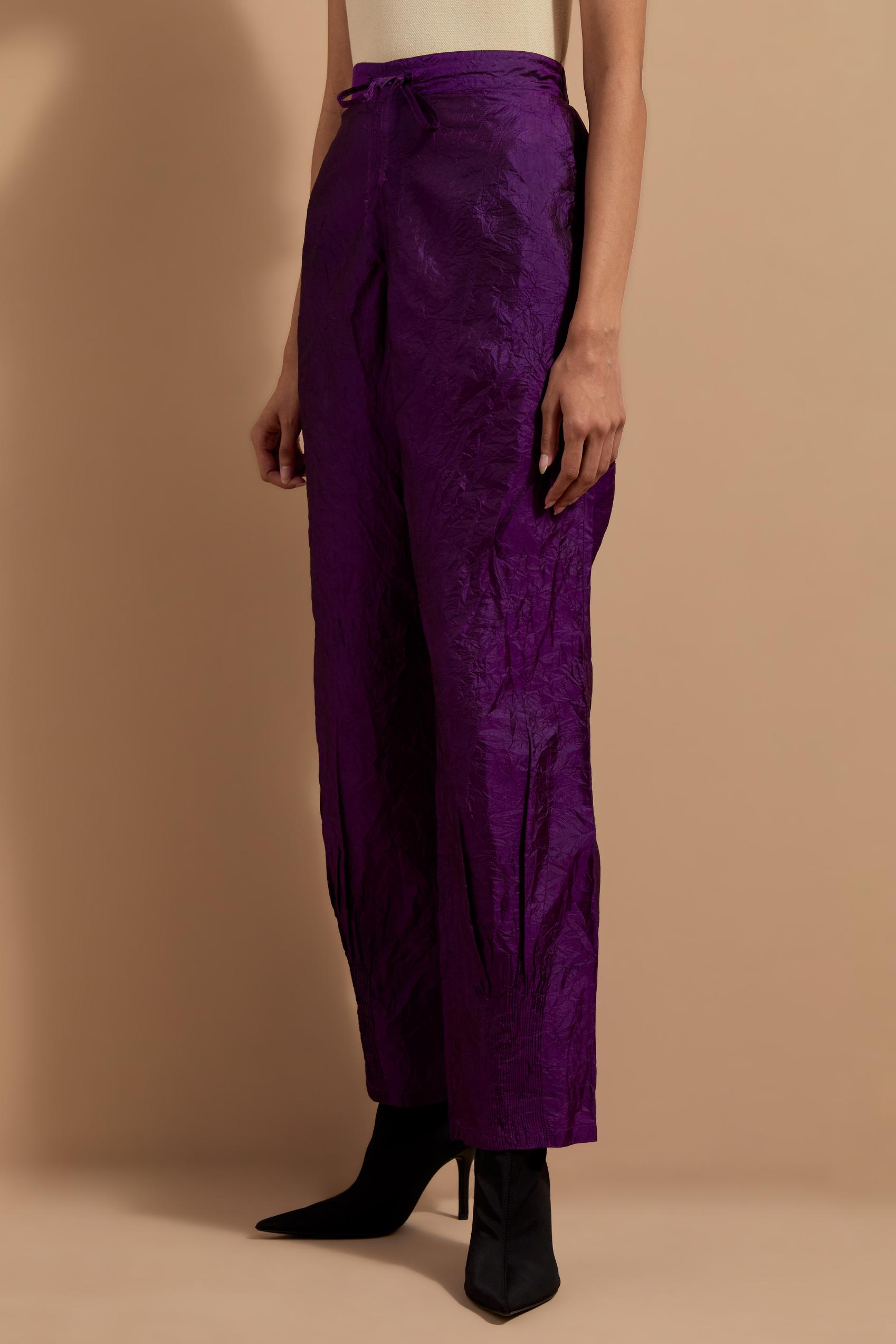 Purple crushed silk hand block printed pants with pin tucks detailing at hem.