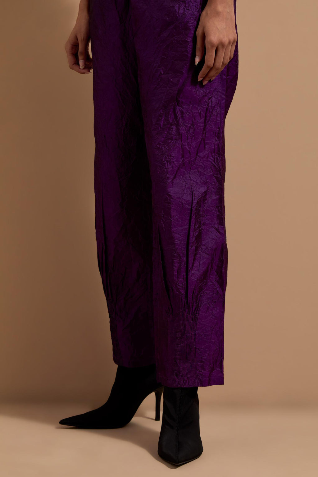 Purple crushed silk hand block printed pants with pin tucks detailing at hem.