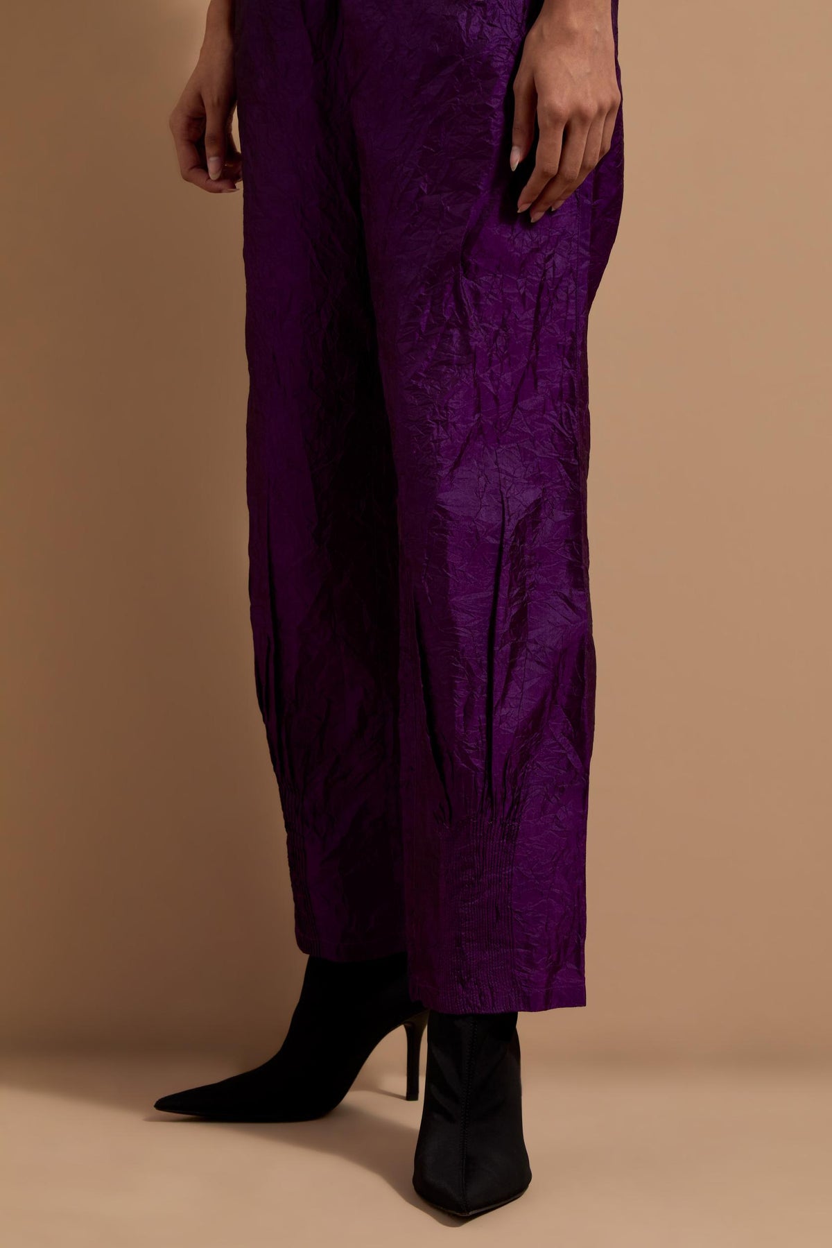 Purple crushed silk hand block printed pants with pin tucks detailing at hem.