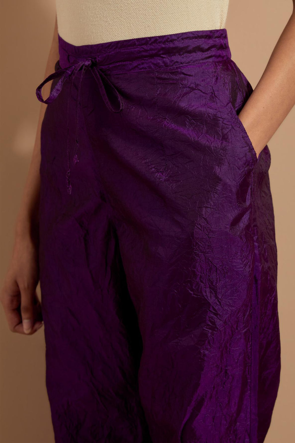 Purple crushed silk hand block printed pants with pin tucks detailing at hem.