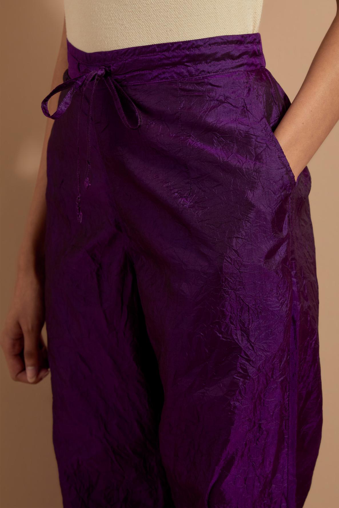 Purple crushed silk hand block printed pants with pin tucks detailing at hem.