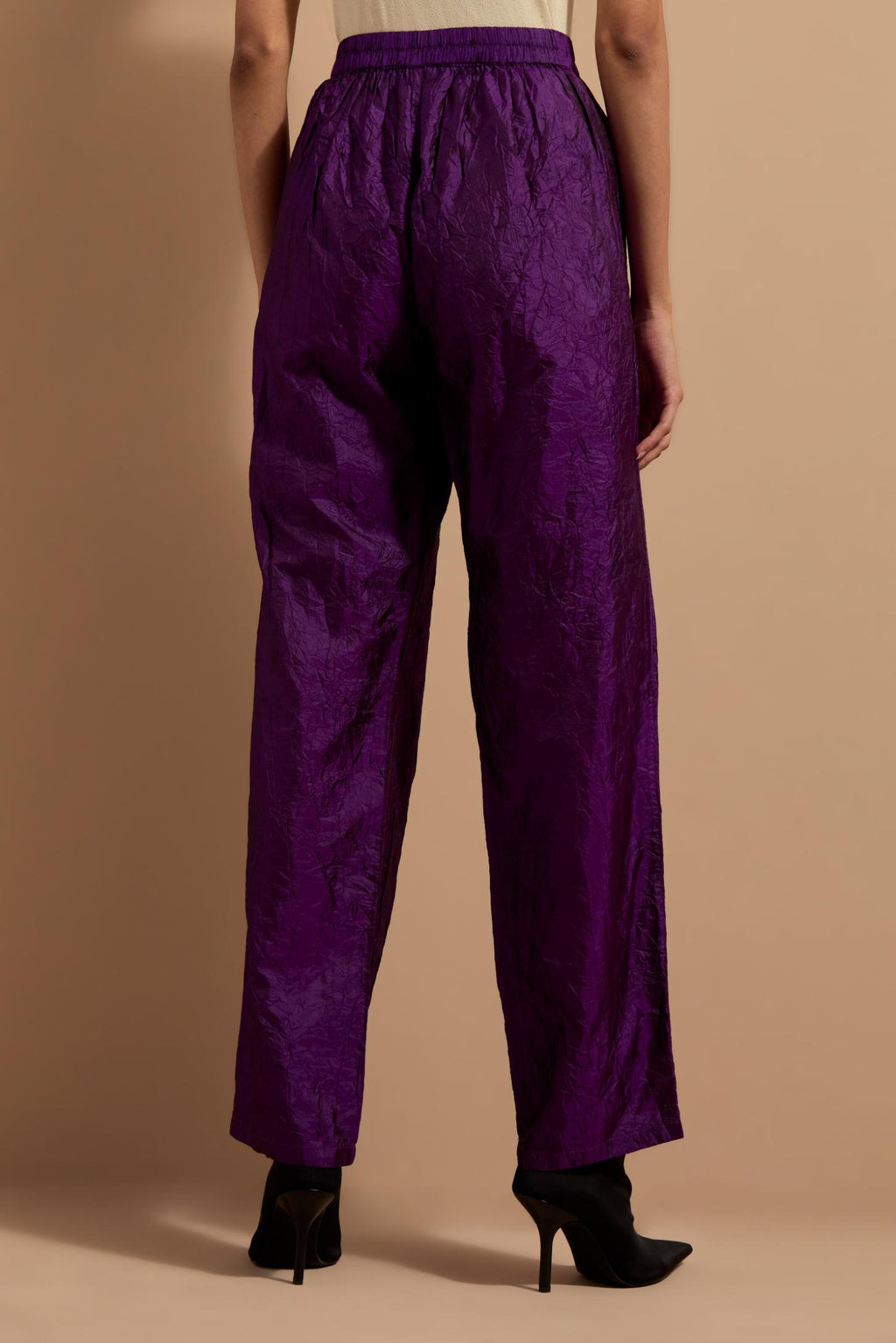 Purple crushed silk hand block printed pants with pin tucks detailing at hem.
