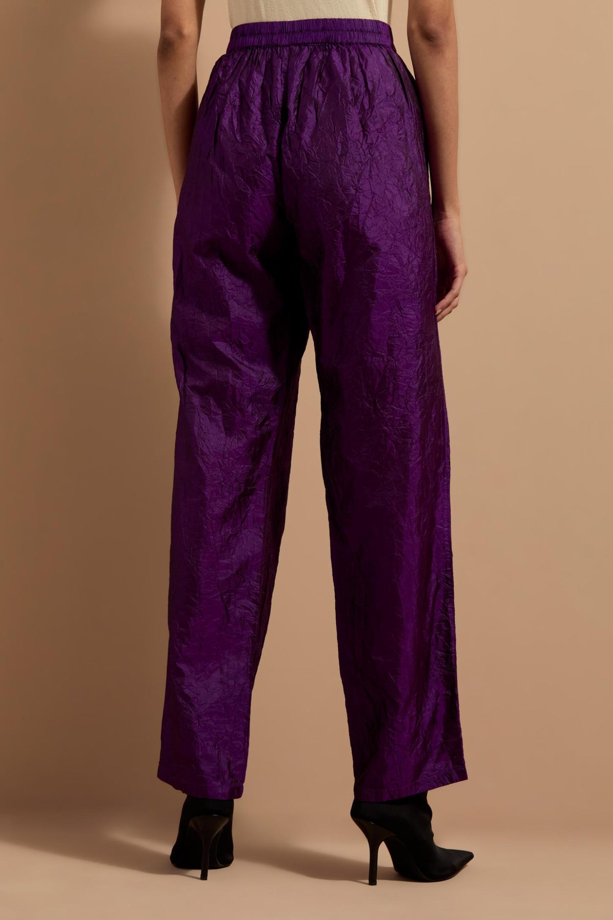 Purple crushed silk hand block printed pants with pin tucks detailing at hem.