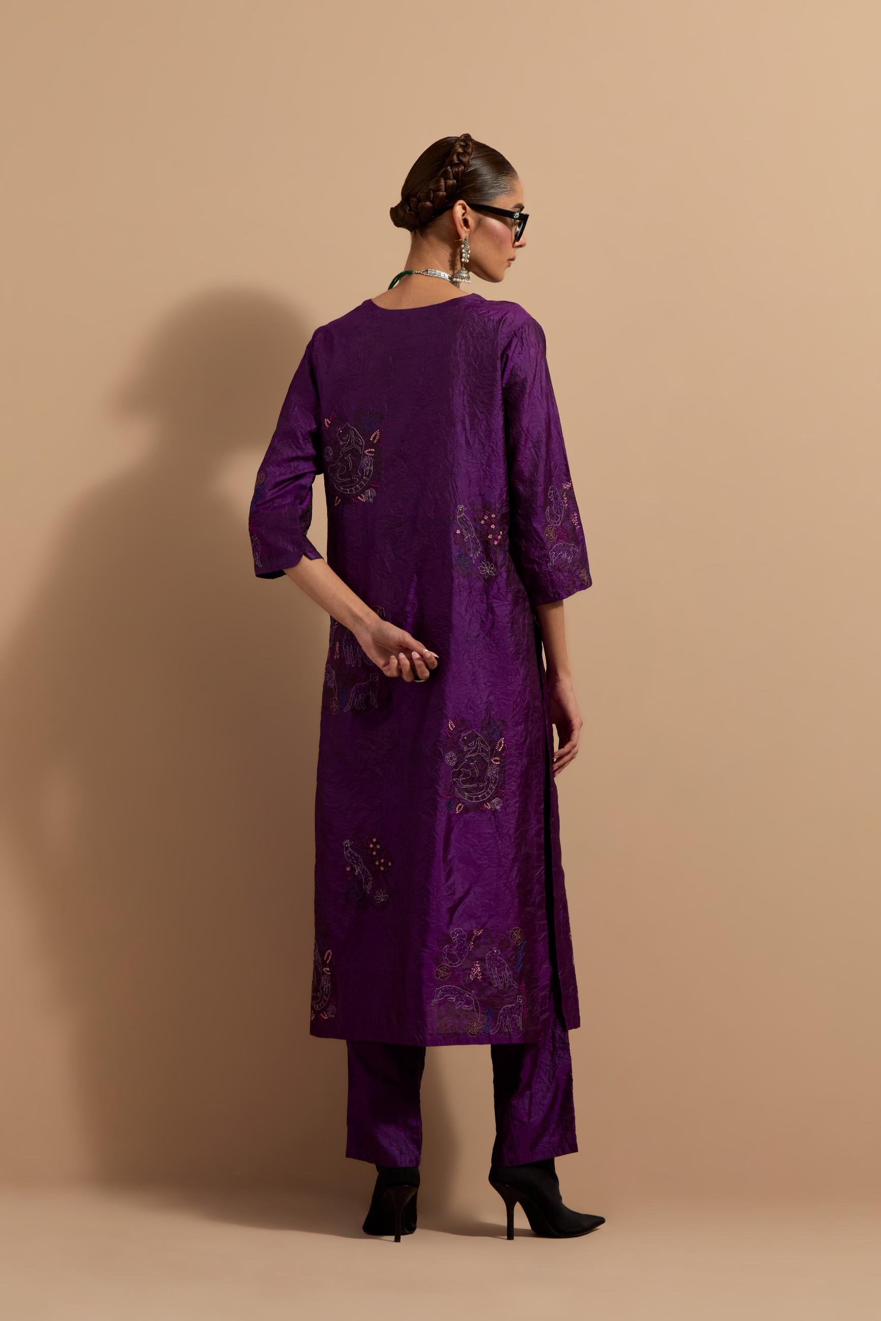 Purple crushed silk hand block printed straight kurta set, highlighted with multi colored thread embroidery.