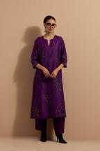Purple crushed silk hand block printed straight kurta set, highlighted with multi colored thread embroidery.