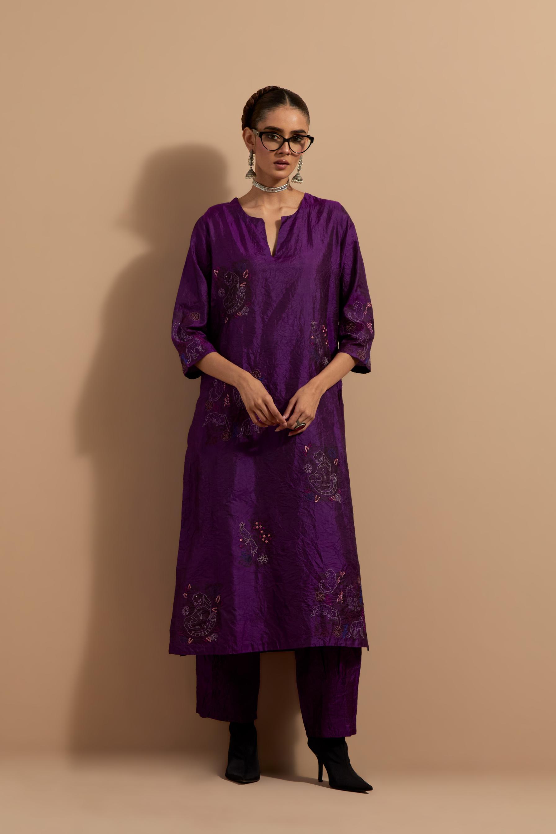 Purple crushed silk hand block printed straight kurta set, highlighted with multi colored thread embroidery.