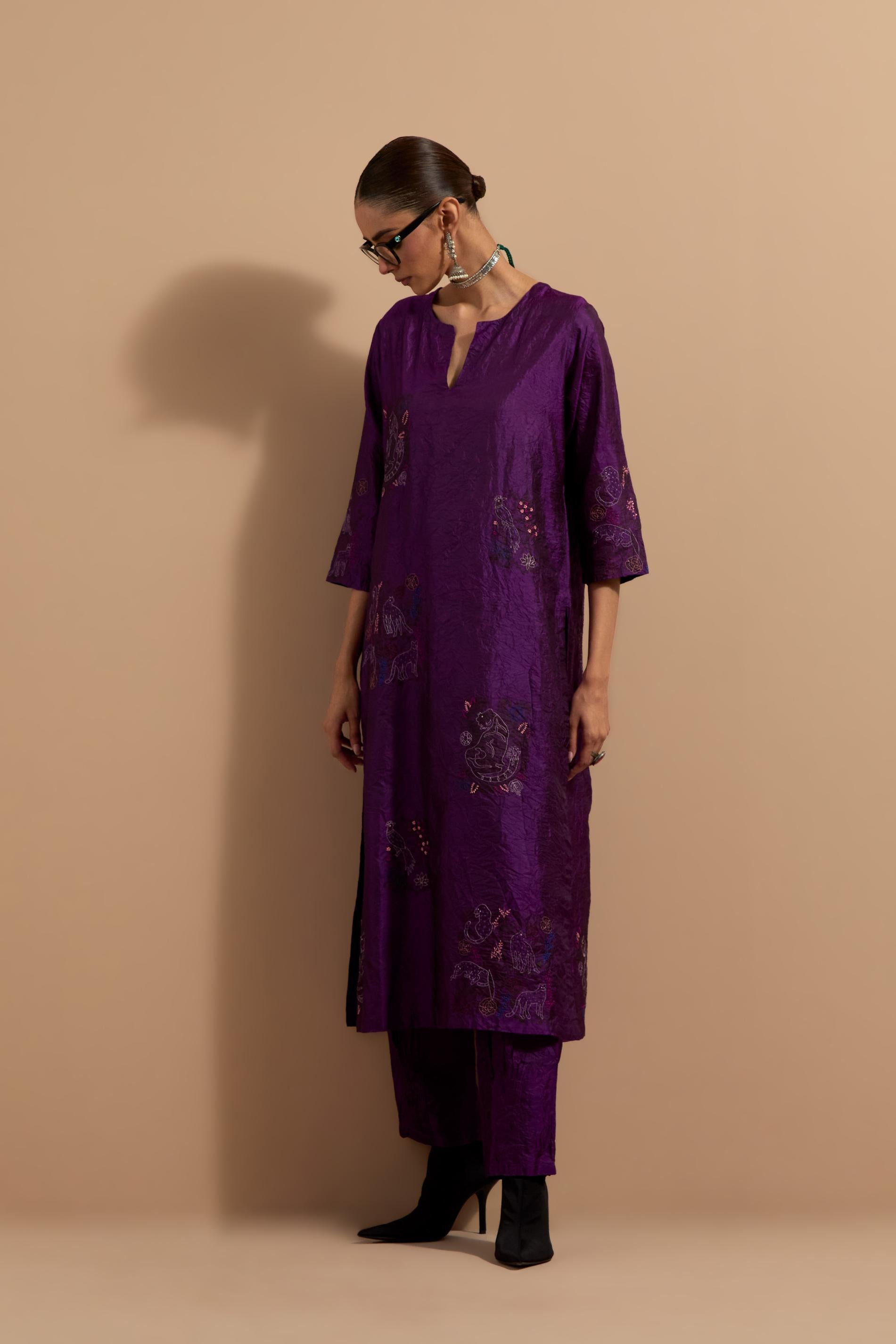 Purple crushed silk hand block printed straight kurta set, highlighted with multi colored thread embroidery.
