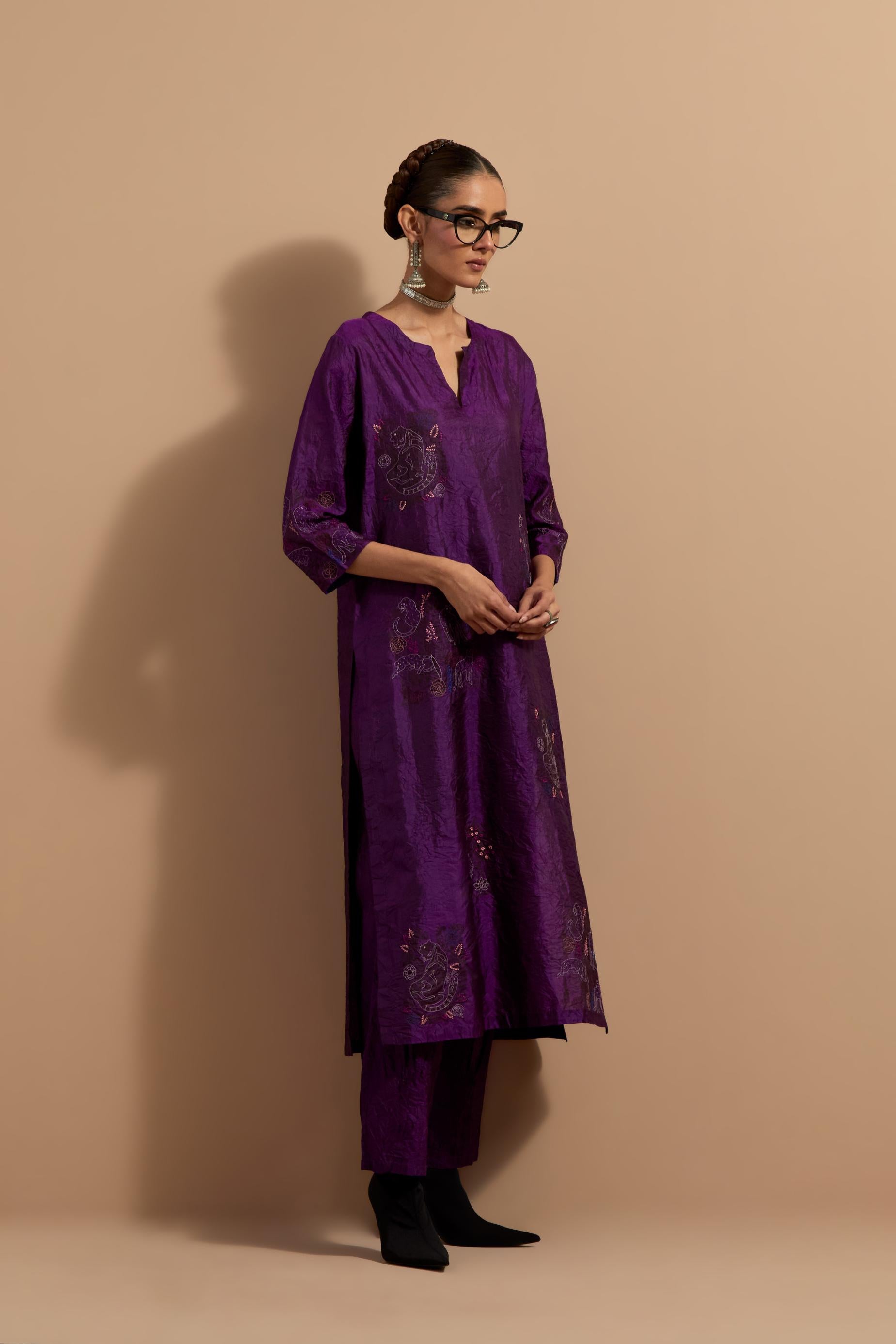 Purple crushed silk hand block printed straight kurta set, highlighted with multi colored thread embroidery.