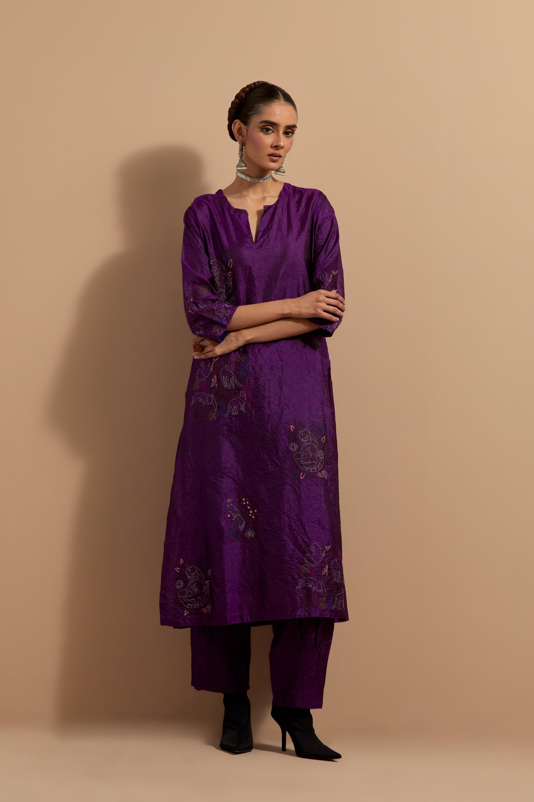 Purple crushed silk hand block printed straight kurta set, highlighted with multi colored thread embroidery.
