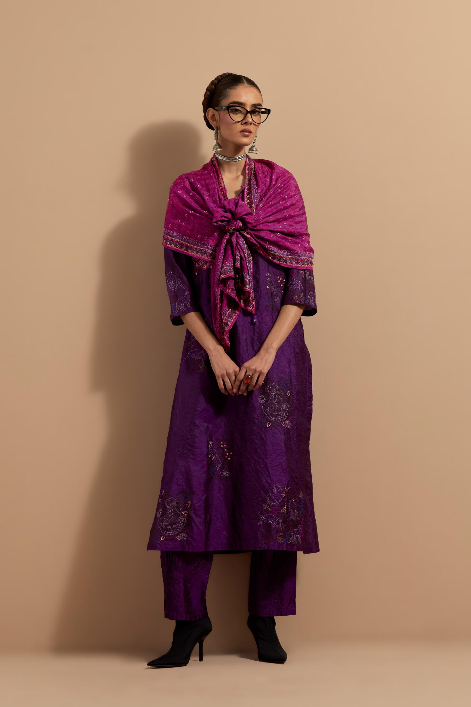 Purple crushed silk hand block printed straight kurta set, highlighted with multi colored thread embroidery.