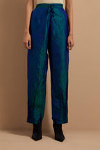 Teal blue crushed silk hand block printed pants with pin tucks detailing at hem.