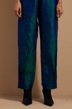 Teal blue crushed silk hand block printed pants with pin tucks detailing at hem.