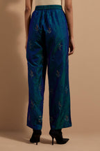 Teal blue crushed silk hand block printed pants, highlighted with multi colored thread embroidery.