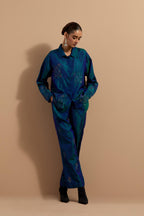 Teal blue crushed silk hand block printed shirt, highlighted with multi colored thread embroidery, paired with Teal blue crushed silk hand block printed pants, highlighted with multi colored thread embroidery.