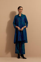 Teal blue crushed silk A-line short kurta set with hand block print, highlighted with multi colored thread embroidery.