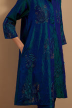 Teal blue crushed silk A-line short kurta set with hand block print, highlighted with multi colored thread embroidery.