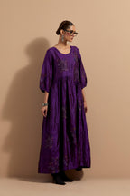 Purple crushed silk hand block printed long dress, highlighted with multi colored thread embroidery, paired with Mauve hand crushed block printed silk stole with quilted embroidery and beaded tassels.