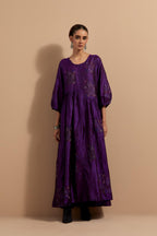 Purple crushed silk hand block printed long dress, highlighted with multi colored thread embroidery, paired with Mauve hand crushed block printed silk stole with quilted embroidery and beaded tassels.