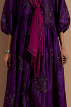Purple crushed silk hand block printed long dress, highlighted with multi colored thread embroidery, paired with Mauve hand crushed block printed silk stole with quilted embroidery and beaded tassels.