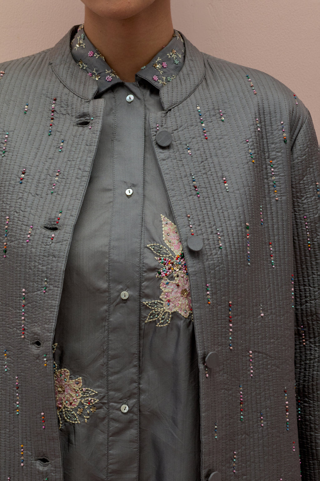 Iron grey silk, quilted short length front open jacket set with all-over sequins and multicolored beads work.