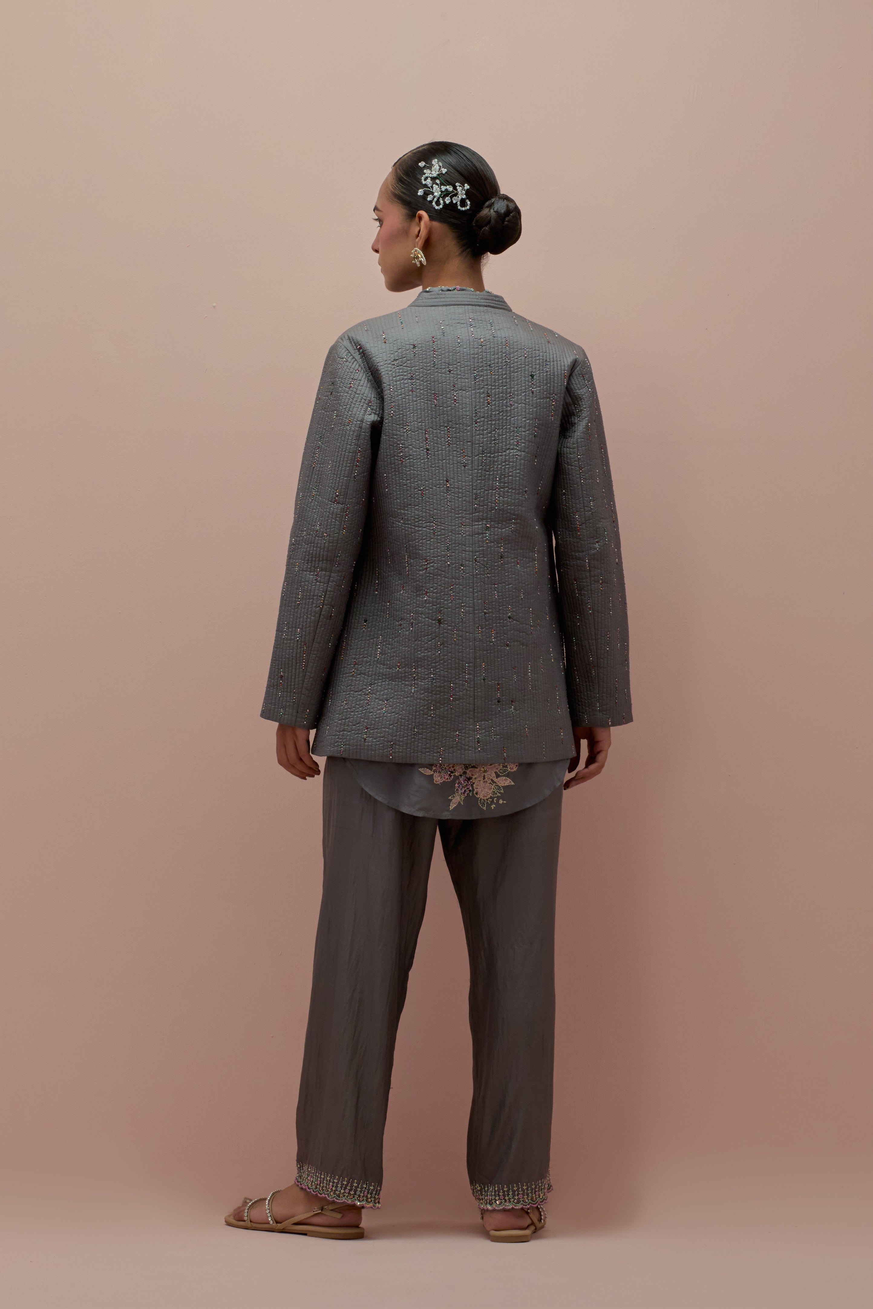 Iron grey silk, quilted short length front open jacket set with all-over sequins and multicolored beads work.