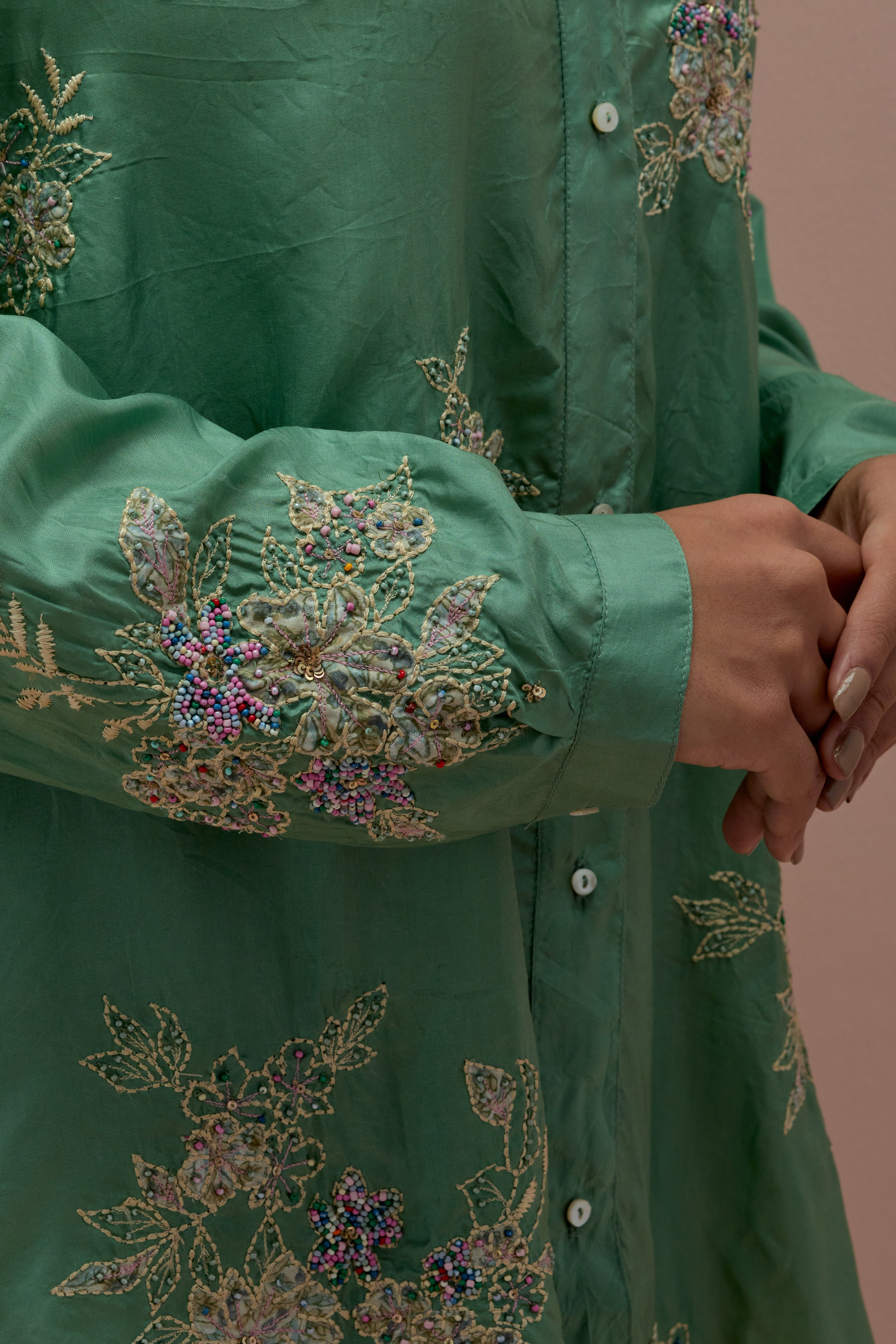 Jade green silk, quilted short length front open jacket set with all-over sequins and multicolored beads work.