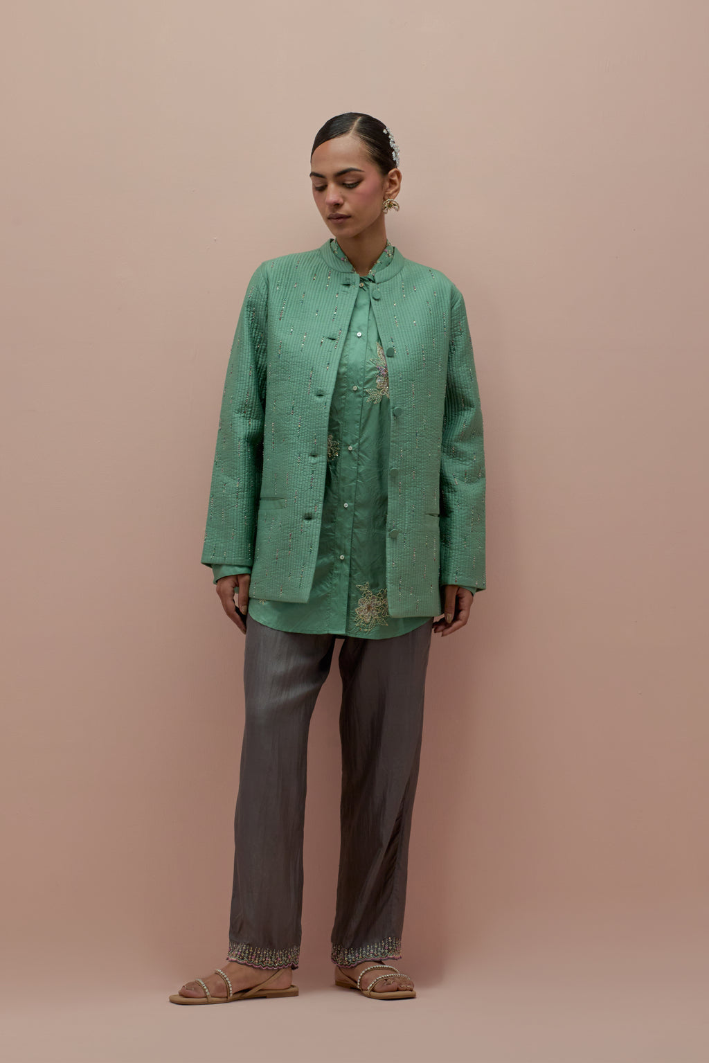 Jade green silk, quilted short length front open jacket set with all-over sequins and multicolored beads work.