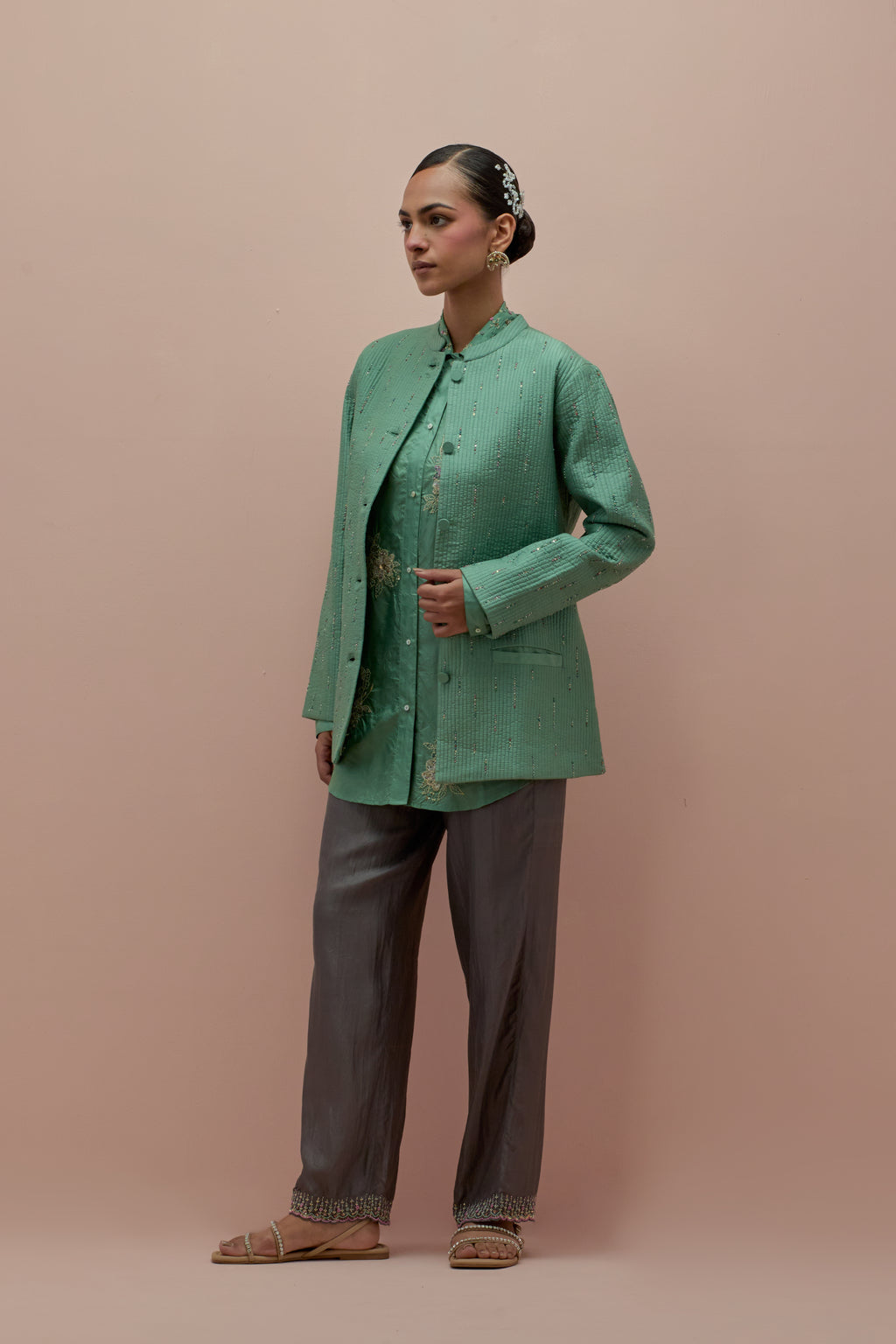 Jade green silk, quilted short length front open jacket set with all-over sequins and multicolored beads work.