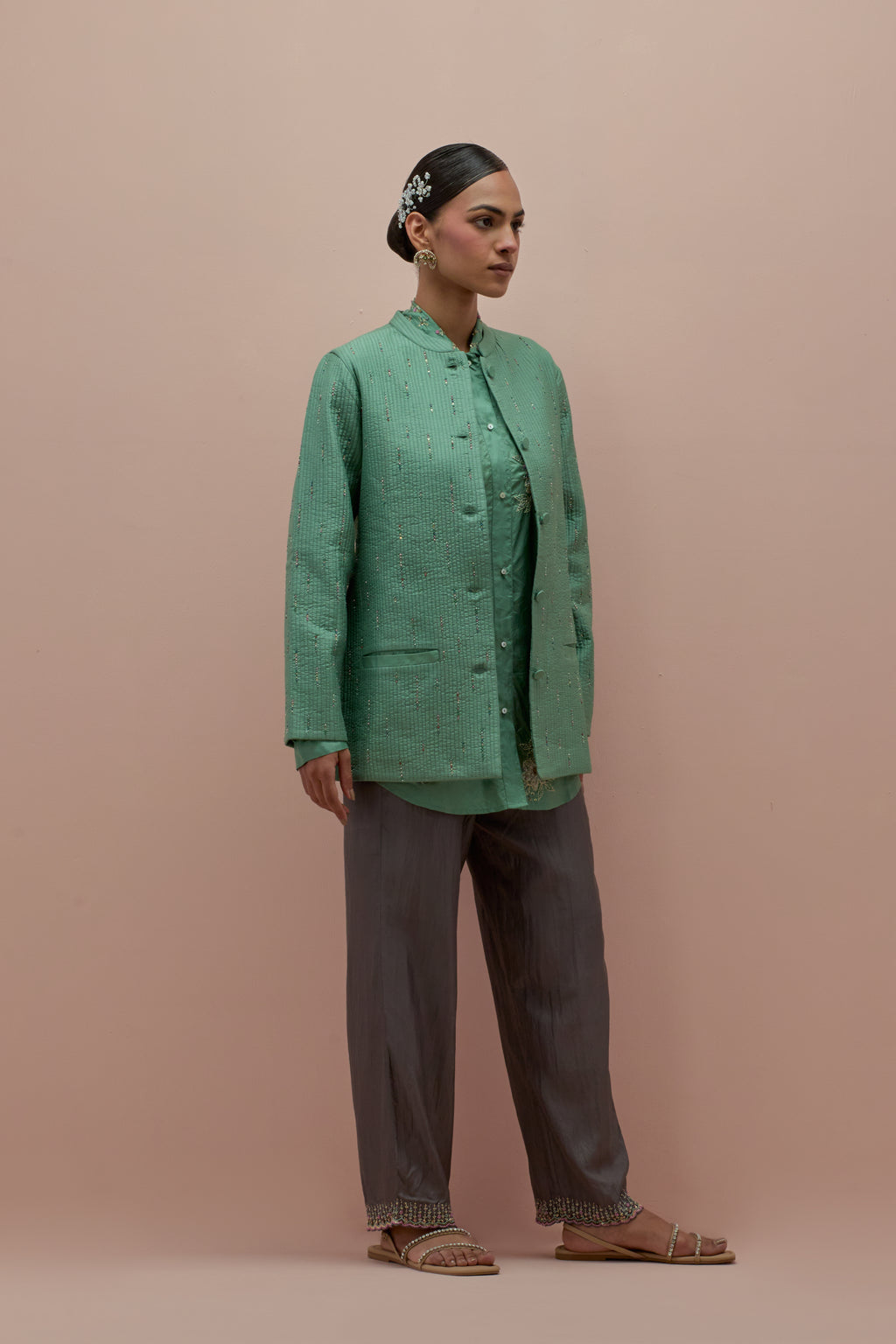 Jade green silk, quilted short length front open jacket set with all-over sequins and multicolored beads work.