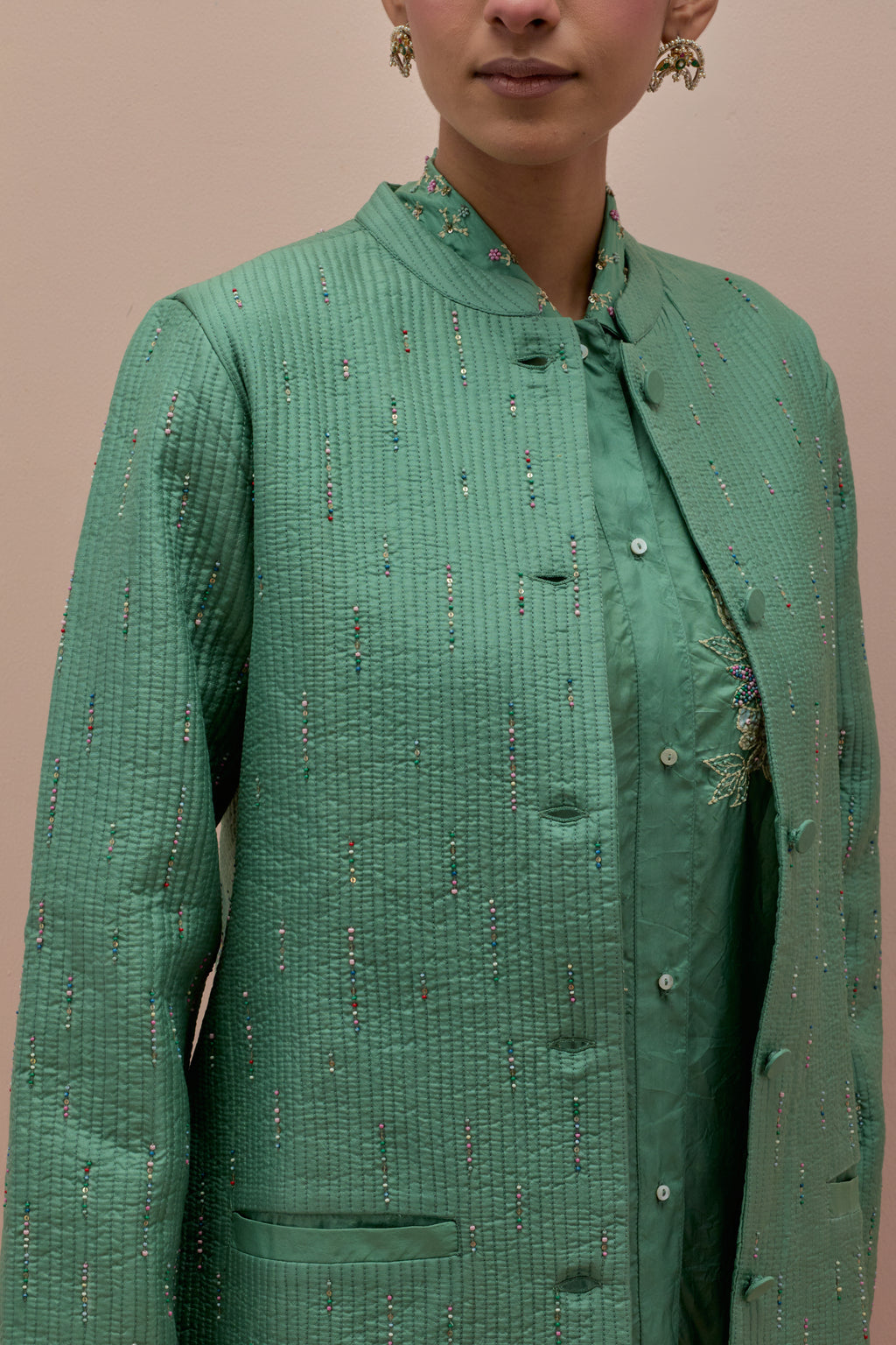 Jade green silk, quilted short length front open jacket set with all-over sequins and multicolored beads work.