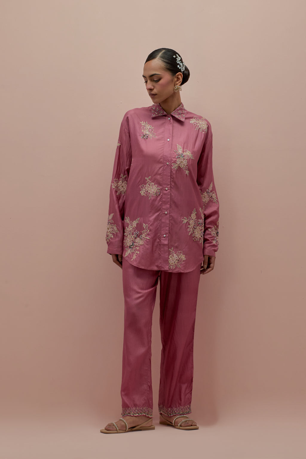 Salmon pink embroidered shirt with full sleeves.