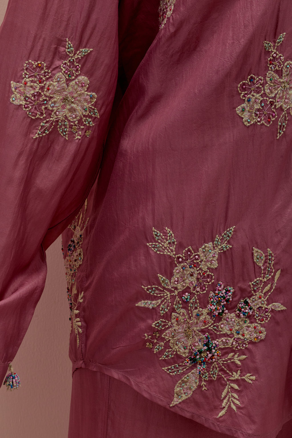 Salmon pink embroidered shirt with full sleeves.