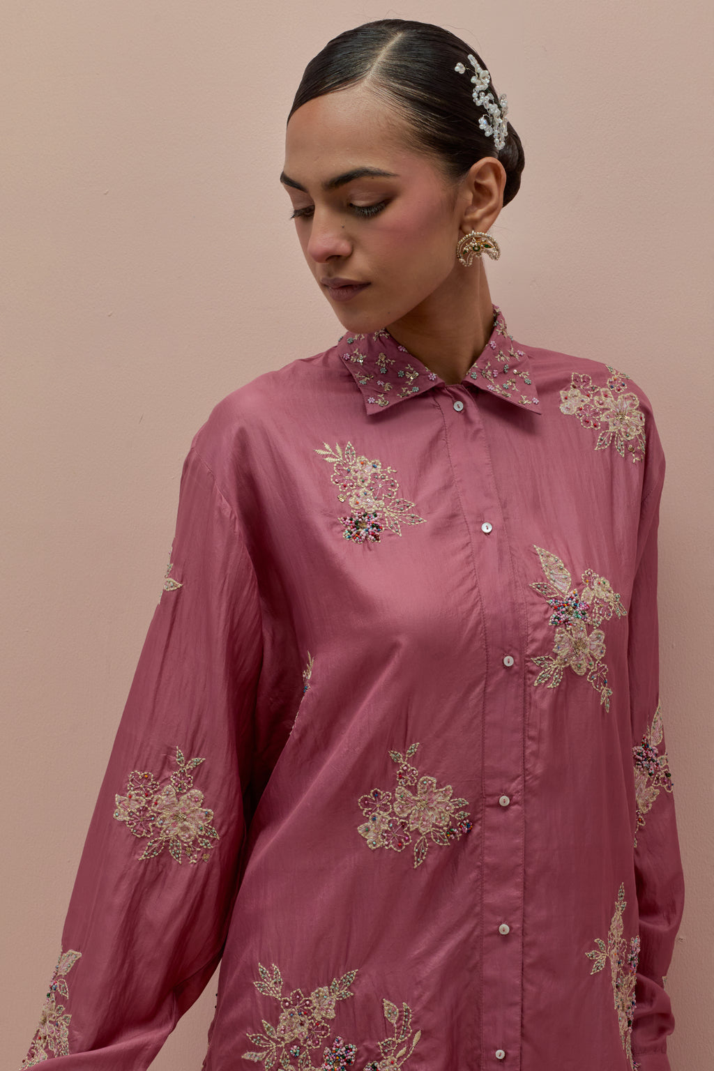 Salmon pink embroidered shirt with full sleeves.