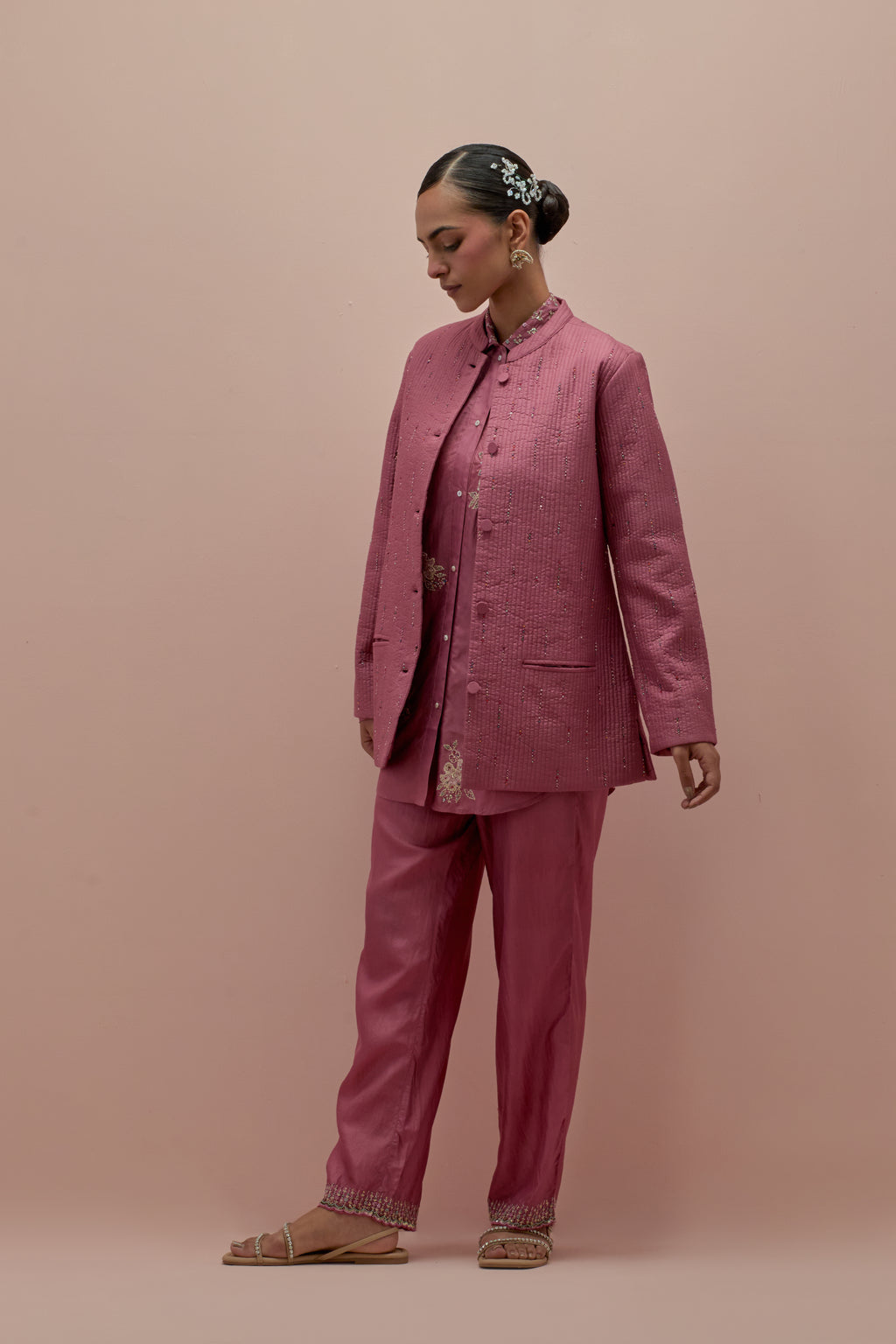 Salmon pink silk, quilted short length front open jacket set with all-over sequins and multicolored beads work.