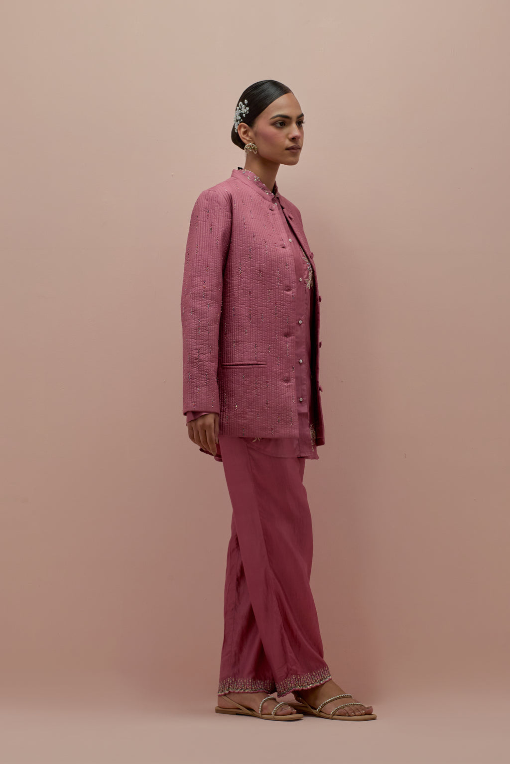 Salmon pink silk, quilted short length front open jacket set with all-over sequins and multicolored beads work.