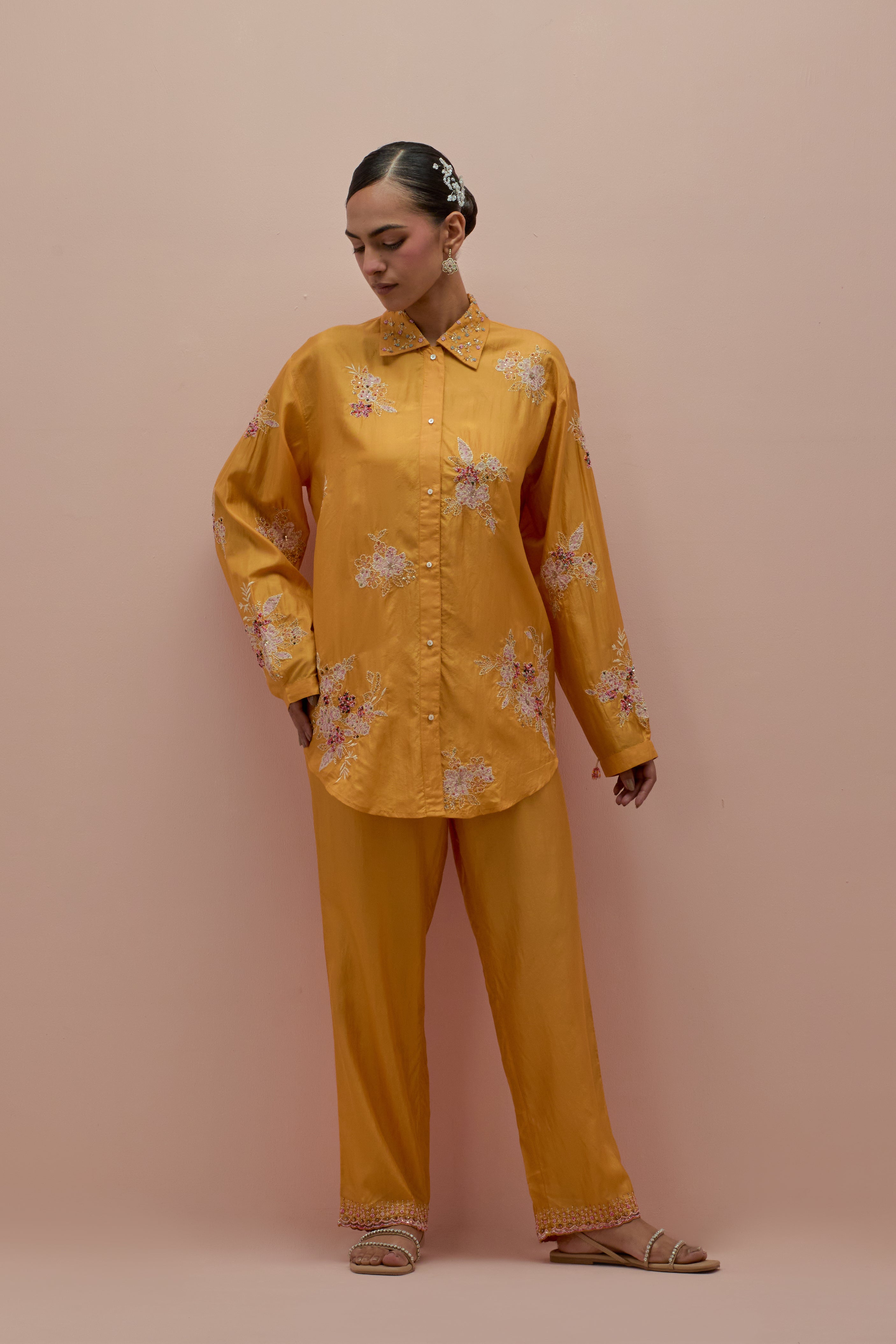 Amber silk, quilted short length front open jacket set with all-over sequins and multicolored beads work.