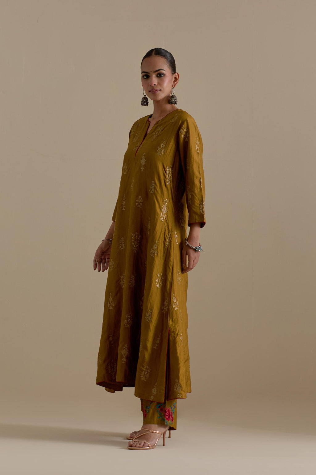 Olive silk straight long kurta set, highlighted with dull gold zari and sequins handwork.