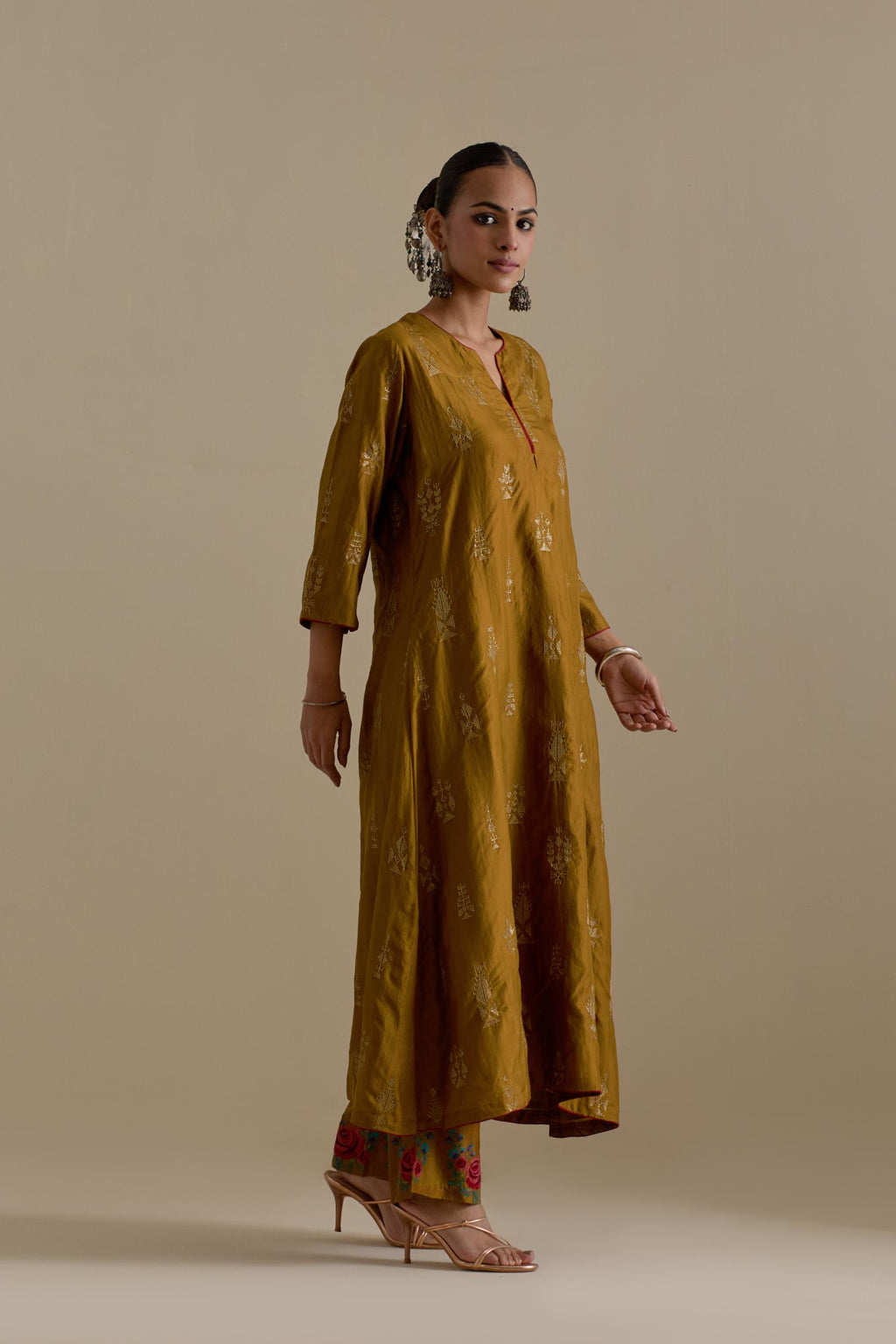 Olive silk straight long kurta set, highlighted with dull gold zari and sequins handwork.