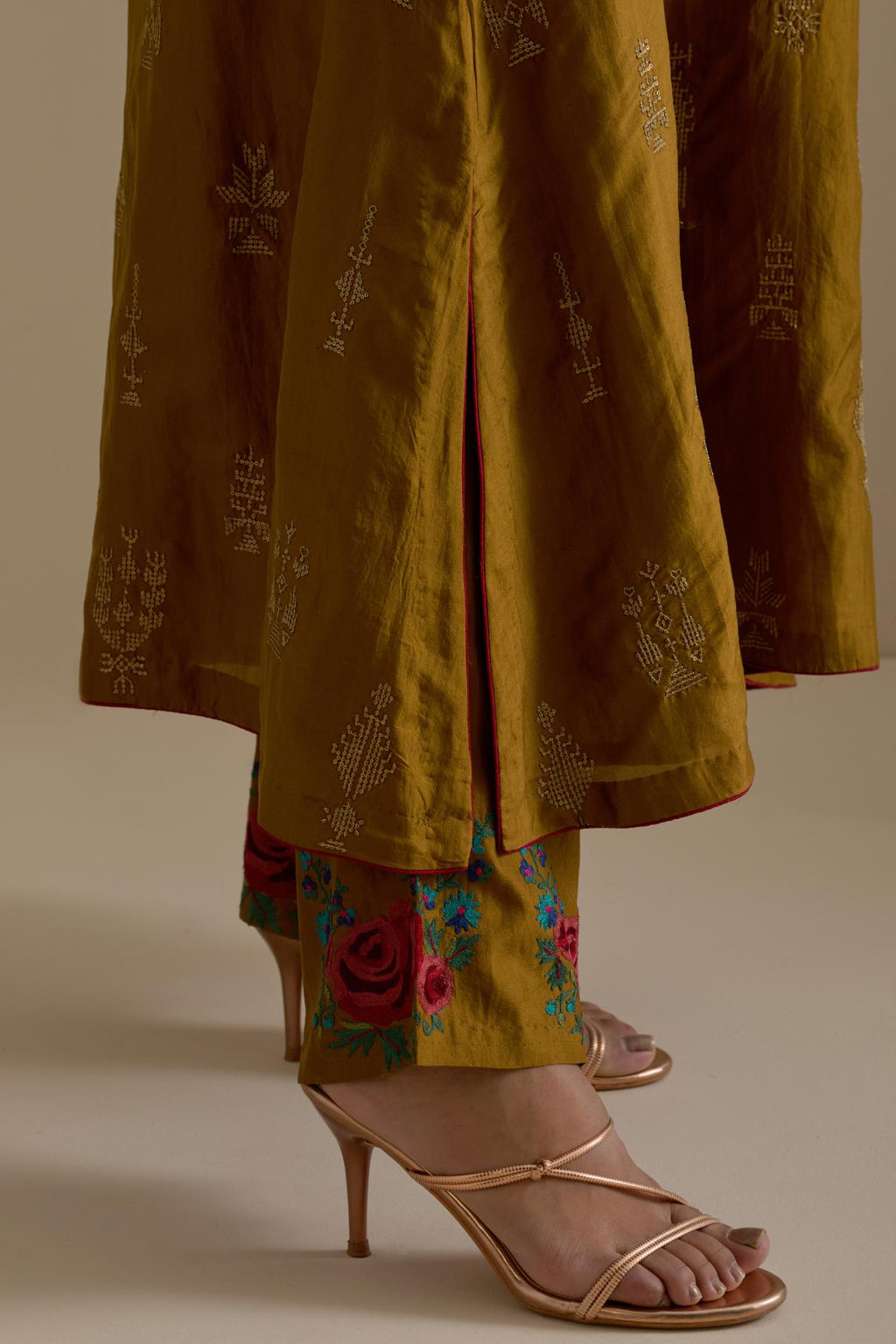 Olive silk straight long kurta set, highlighted with dull gold zari and sequins handwork.