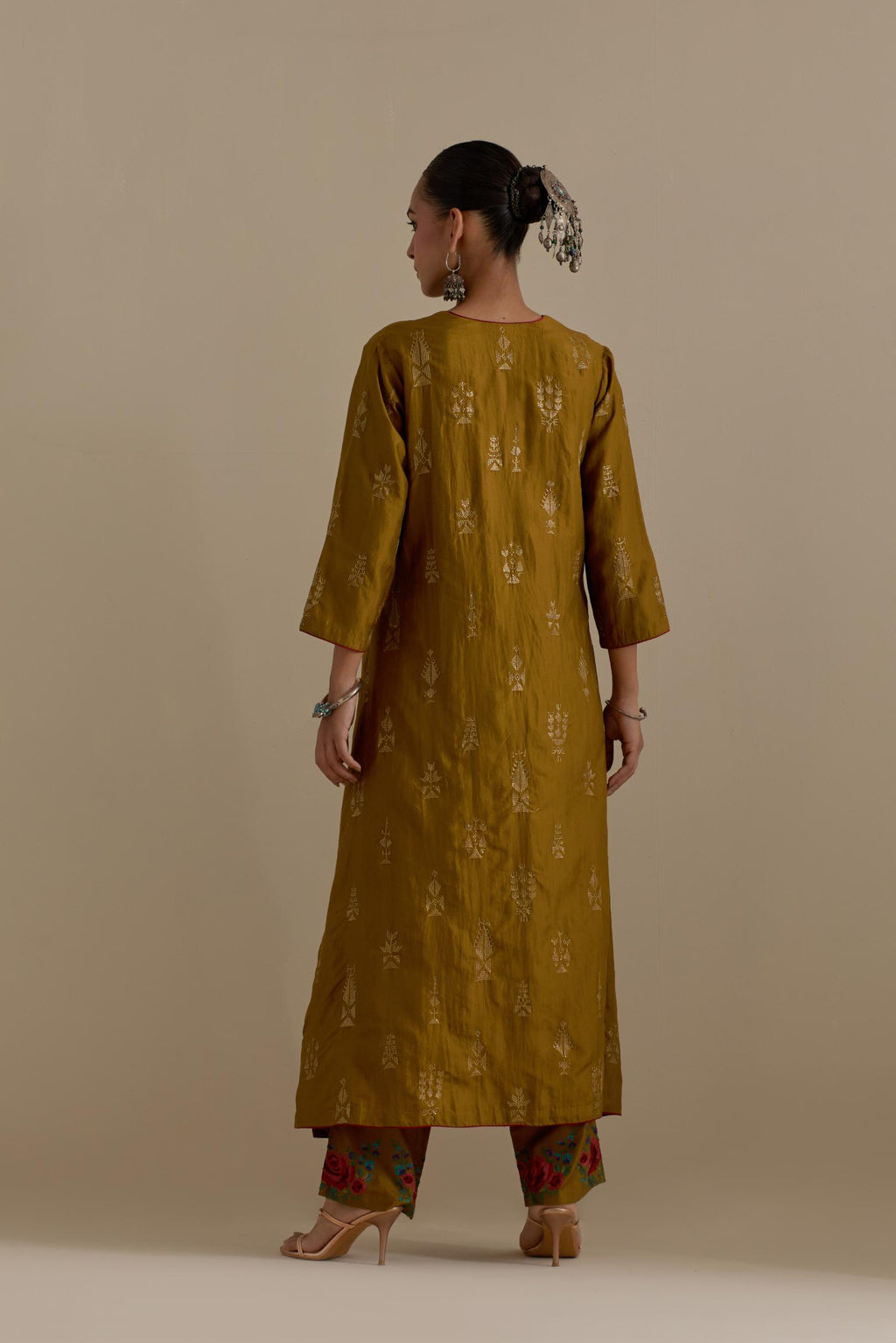 Olive silk straight long kurta set, highlighted with dull gold zari and sequins handwork.