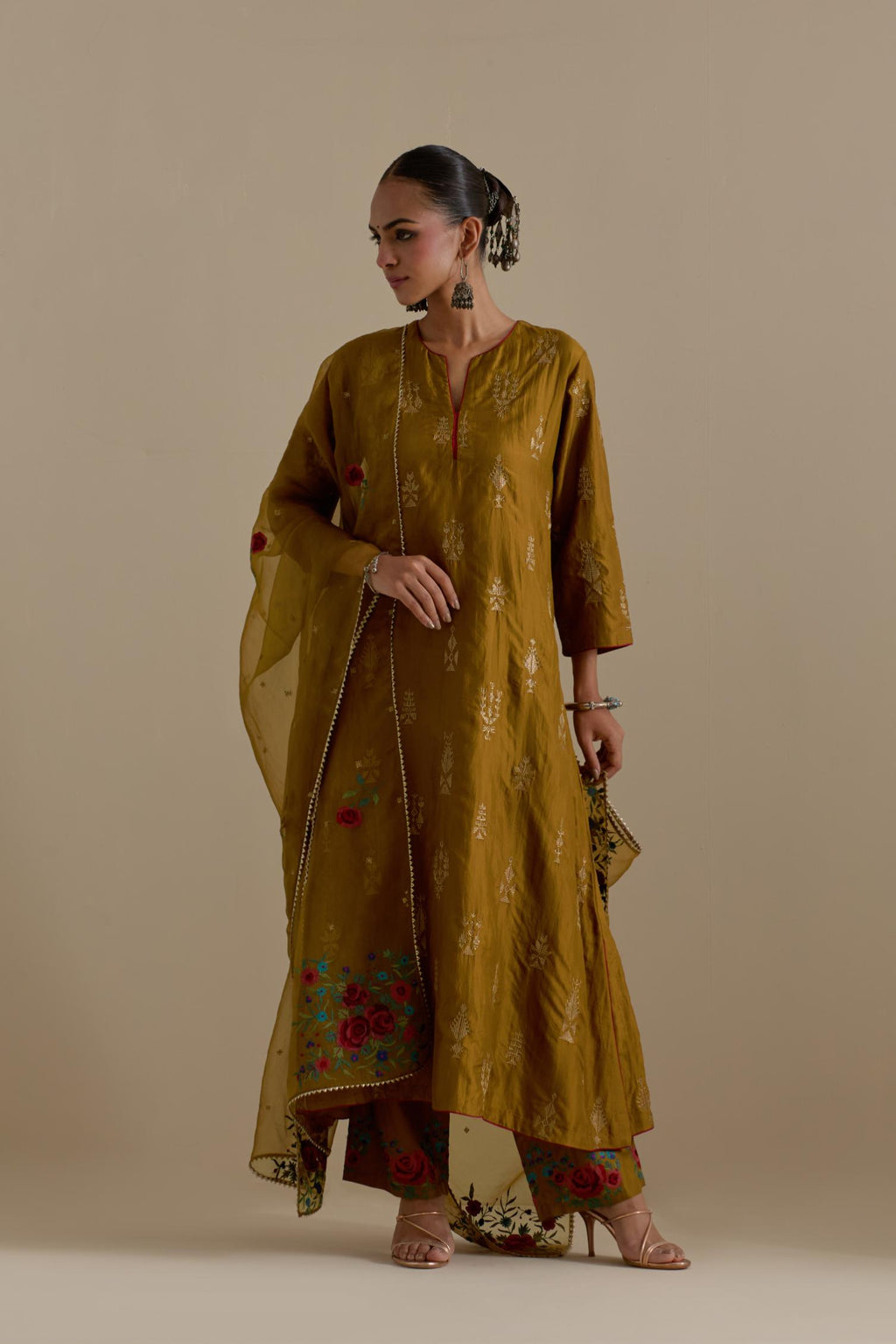 Olive silk straight long kurta set, highlighted with dull gold zari and sequins handwork.